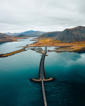 Aerial drone view of Viking Bridge, sword shaped bridge on the Snaefellsnes Peninsula, West Iceland.