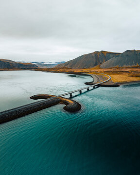 Aerial drone view of Viking Bridge, sword shaped bridge on the Snaefellsnes Peninsula, West Iceland.