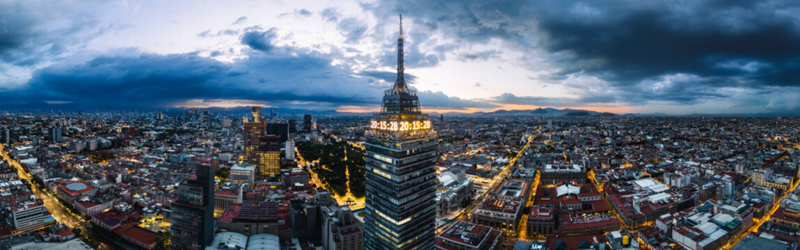 Aerial drone panorama view of Torre Latinoamericana in downtown Mexico City at blue hour, Mexico.