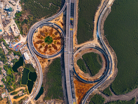 Aerial view of roundabout patterns on Trans Harbour Link Road, Sewri, Nhava Sheva, Ulwe, Panvel, Maharashtra, India.