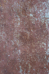 faded and rusted painted metal surface