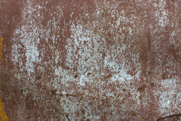 faded and rusted painted metal surface