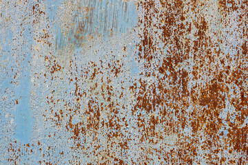 faded and rusted painted metal surface