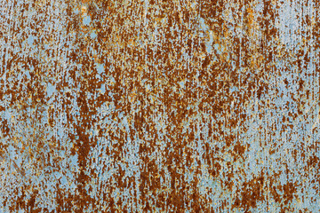 faded and rusted painted metal surface