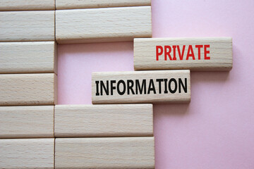Private Information symbol. Wooden blocks with words Private Information. Beautiful pink...