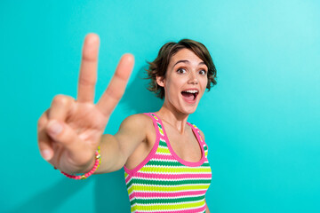 Photo portrait of funny overjoyed lady showing two fingers v sign countdown one two three isolated...