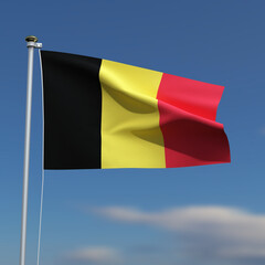 Belgium Flag is waving in front of a blue sky with blurred clouds in the background