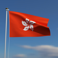 Hong Kong Flag is waving in front of a blue sky with blurred clouds in the background