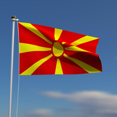 Macedonia Flag is waving in front of a blue sky with blurred clouds in the background