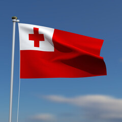 Tonga Flag is waving in front of a blue sky with blurred clouds in the background