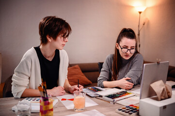 Two designers in deep discussion, one gesturing to express her point, capturing a moment of...