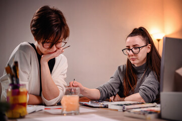 Two designers in deep discussion, one gesturing to express her point, capturing a moment of...