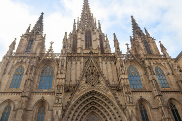 Fototapeta na wymiar Facade of Gothic Cathedral of the Holy Cross and Saint Eulalia in Barcelona, Spain