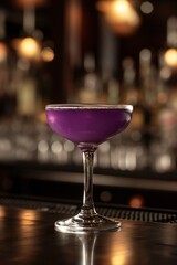 Elegant purple Aviation cocktail in a glass on a bar counter, with a warm, blurred background