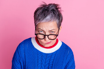 Photo of nice aged lady ponder empty space wear blue sweater isolated on pink color background