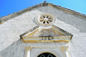 Baroque decor on the facade of the Church of Our Lady of the Rosary in Perast, Montenegro