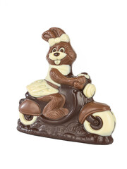chocolate rabbit in dress on scooter handmade on a white background