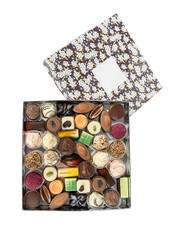 handmade sweets in a cardboard box with a lid on a white background