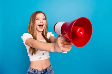 Fotobehang Graffiti collage Photo of nice young girl loudspeaker empty space wear top isolated on blue color background