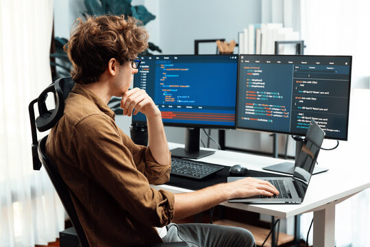 Working IT developer with stressful overworked in creating online software development coding on pc screen, thinking program for latest version application on website project at modern office. Gusher.