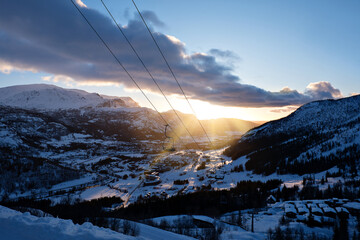 Sunrise over the Norwegian Alps in Hemsedal with ski chairlift 