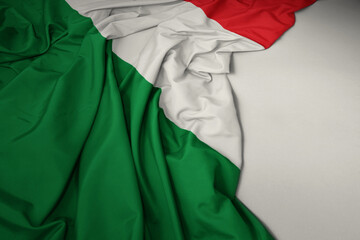 waving national flag of italy on a gray background.