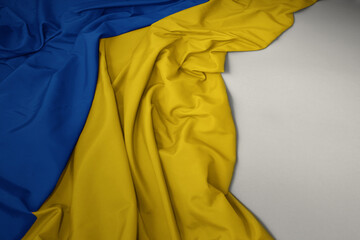 waving national flag of ukraine on a gray background.