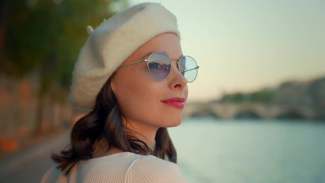 Woman in Beret and Sunglasses by Water