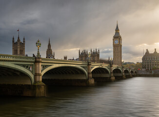 Westminster Bridge,  Big Ben, The Houses of Parliament and The River Thames in London England in the warm evening sunshine