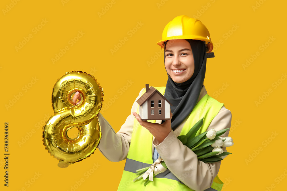 Poster Muslim female construction worker with toy house, white tulips and balloon in shape of figure 8 on yellow background. Women's Day celebration