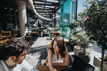 Fototapeta premium A multigenerational pair of business entrepreneurs engaging in a strategic meeting at a contemporary coffee bar, discussing growth and expansion plans.