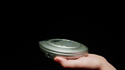 Vintage cd music player close-up. Using portable music player for listening with compact disc