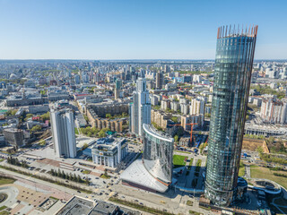 Fototapeta premium Yekaterinburg city with Buildings of Regional Government and Parliament, Dramatic Theatre, Iset Tower, Yeltsin Center, panoramic view at summer sunset.