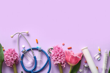 Stethoscope with syringes, ampules and flowers for International Nurses Day on lilac background
