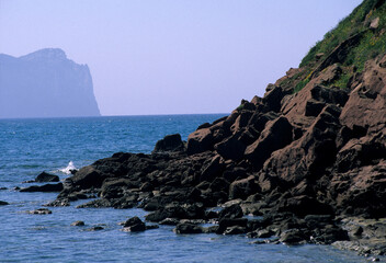 rocks and sea, Punta Cristallo seen from Porto Ferro. Alghero. Sassari. Sardinia. Italy