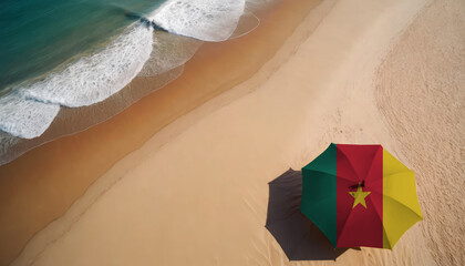 An aerial vista of a sandy beach with gentle ocean waves, featuring a beach umbrella adorned with the Cameroon flag. Ideal for Cameroon tourists seeking seaside relaxation