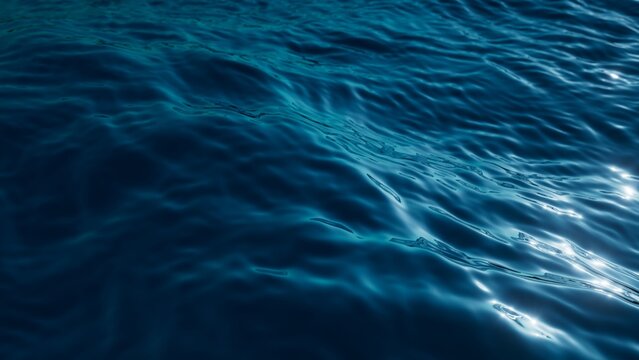 3d render, abstract background of a tranquil and deep blue water surface, with gentle ripples catching the light, conveying a sense of calm and depth. Wallpaper of wavy sea surface