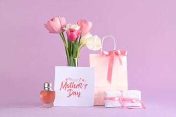 Greeting card with text HAPPY MOTHER'S DAY, beautiful tulips, gift box and bottle of perfume on...