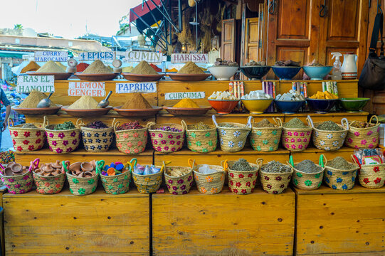Colorful Moroccan spice market in traditional wicker baskets