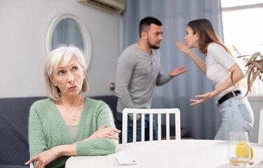 Offended elderly mother dont speaking with adult children during home quarrel - obrazy, fototapety, plakaty
