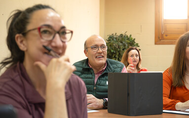Senior adults engaged in a lively educational class