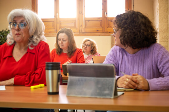 Senior women engaged in lifelong learning class