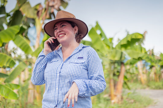Businesswoman from the agriculture industry chats through her smartphone.