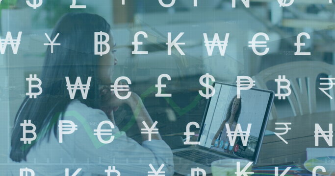 Two colleagues, biracial woman and African American woman, are looking at a laptop