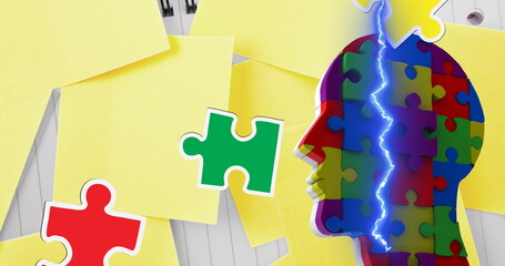 A head shaped like a colorful puzzle piece with big yellow sticky notes around it