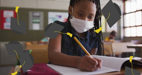 In school, African American student wearing mask is writing - Powered by Adobe