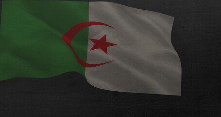 Naklejka premium A flag with green and white sections and red crescent and star is waving