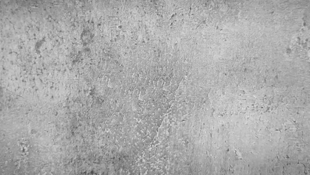 Zoom-in footage of an old seamless gray rugged concrete surface. concrete surface background