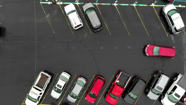 Aerial: Drone Top Forward Shot Of Cars Parked In Parking Lot - Rural, Idaho
