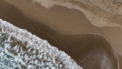 Beautiful texture of powerful dark sea waves with white strokes. Aerial view footage of amazing...
